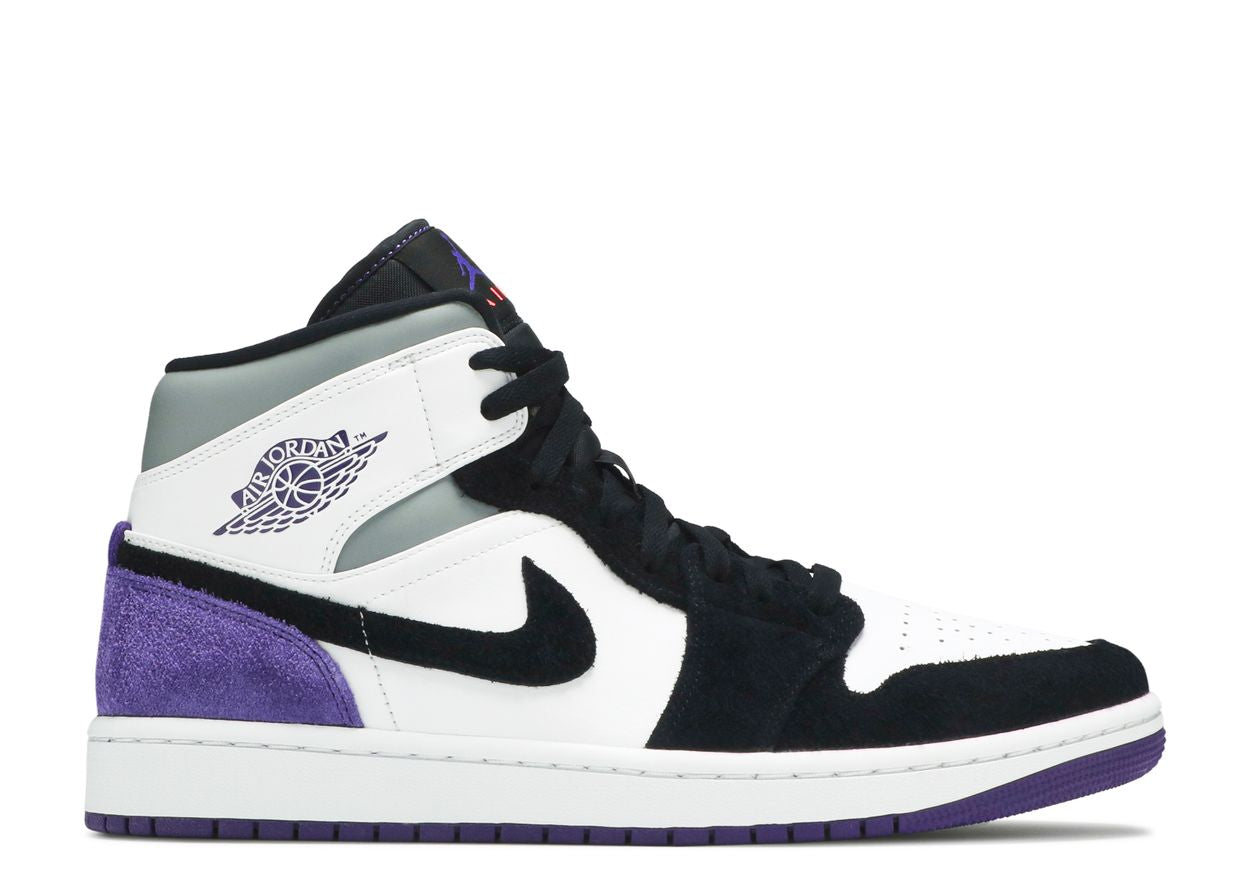 Black jordans with purple logo best sale